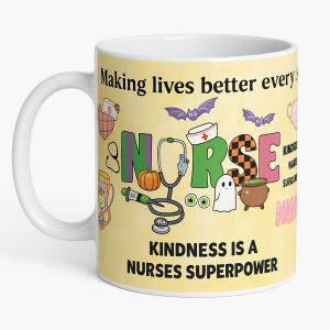 =White ceramic 15 oz mug with Halloween-themed nurse design and the text “Kindness is a nurses superpower,” featuring bats, pumpkin, stethoscope, and ghost.